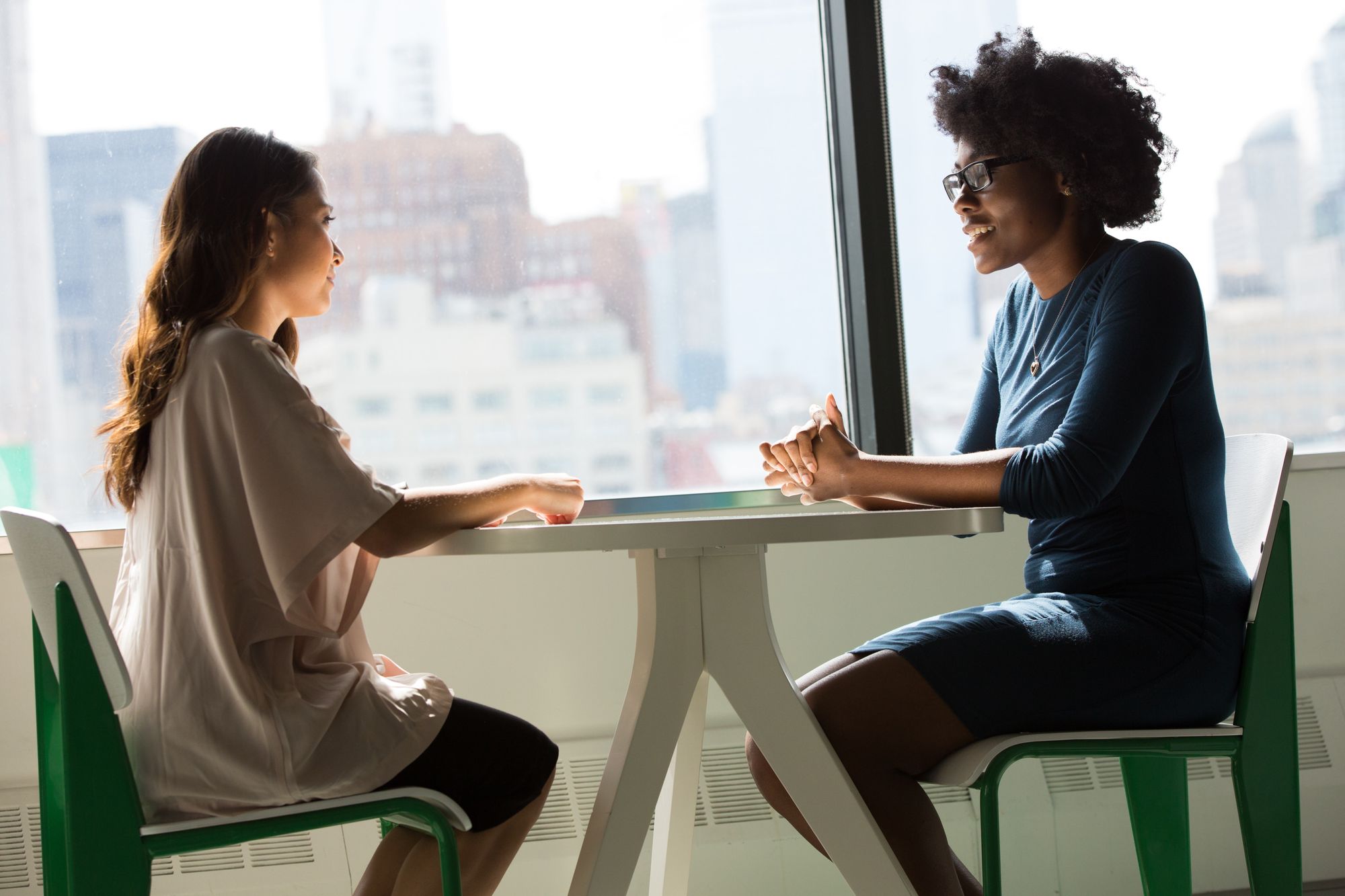 two women discussing - career coaching